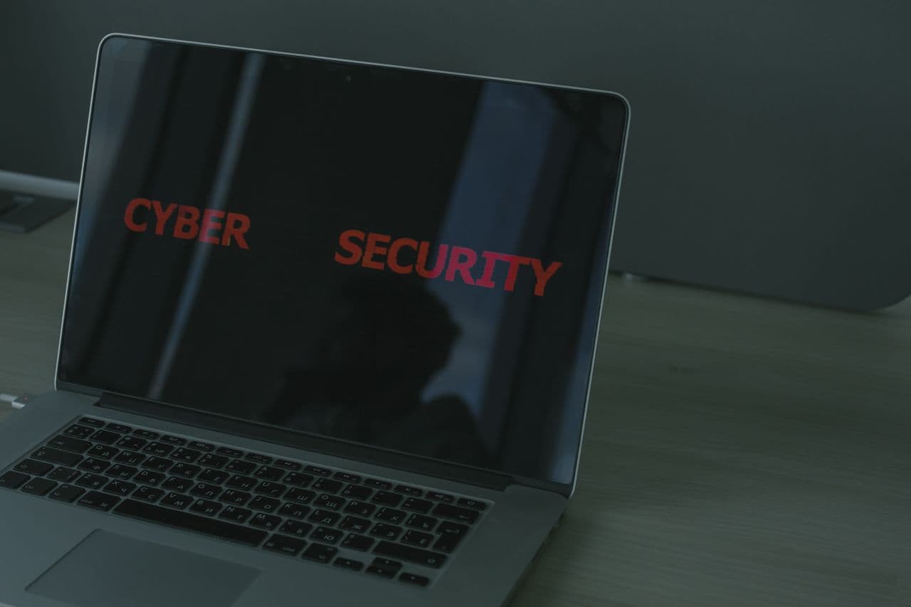 Data security and cyber-risk monitoring on a laptop screen