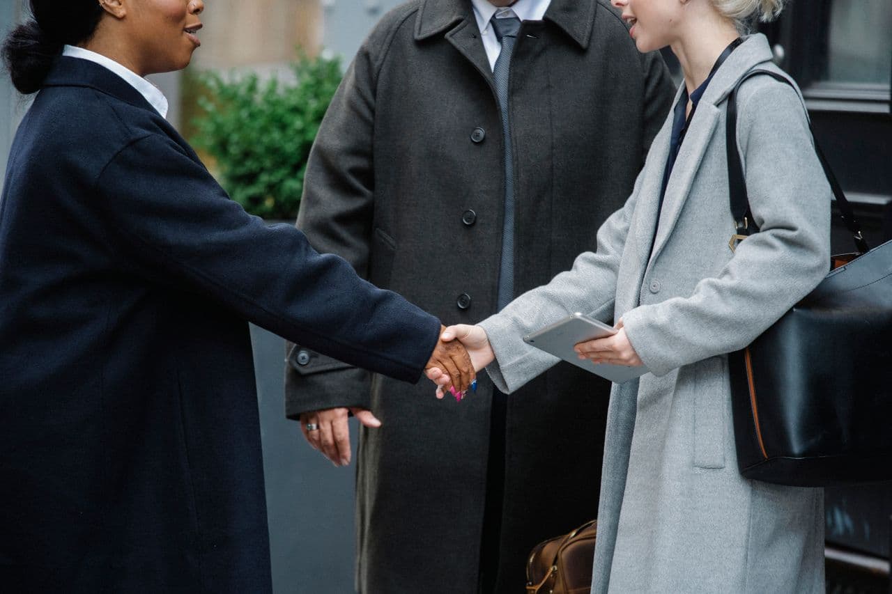 A business advisor meeting with a client across a table