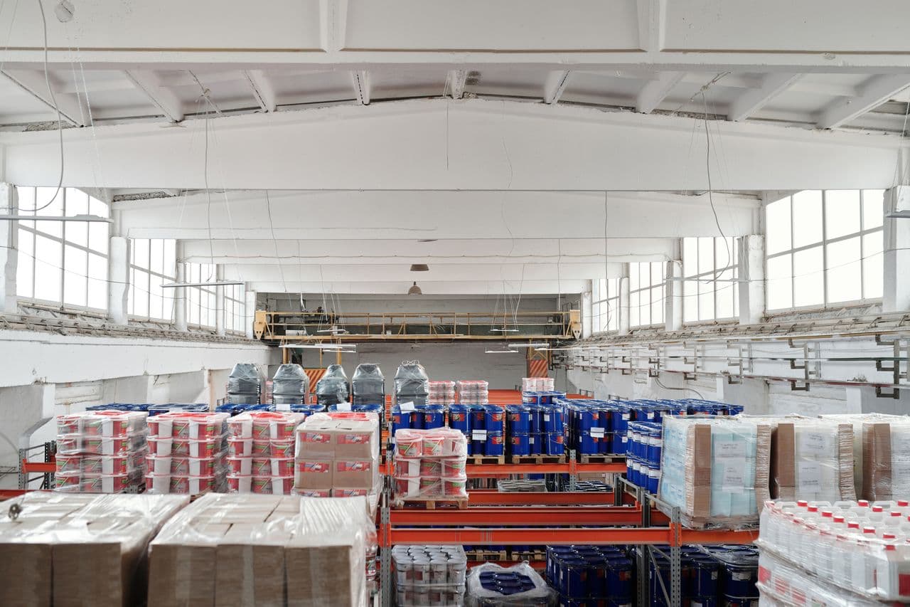 Warehouse operations with racked inventory and a forklift