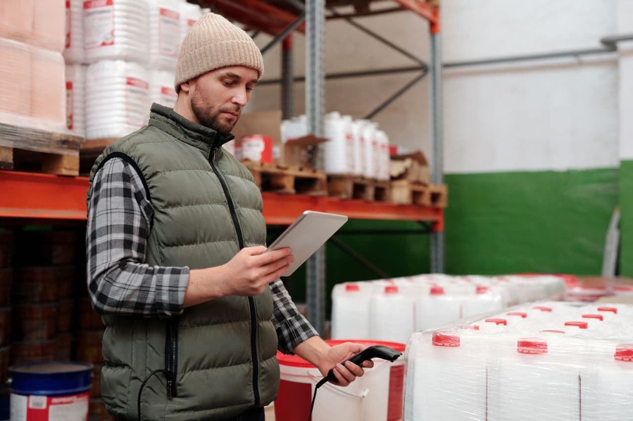 A logistics worker using supply-chain tracking technology