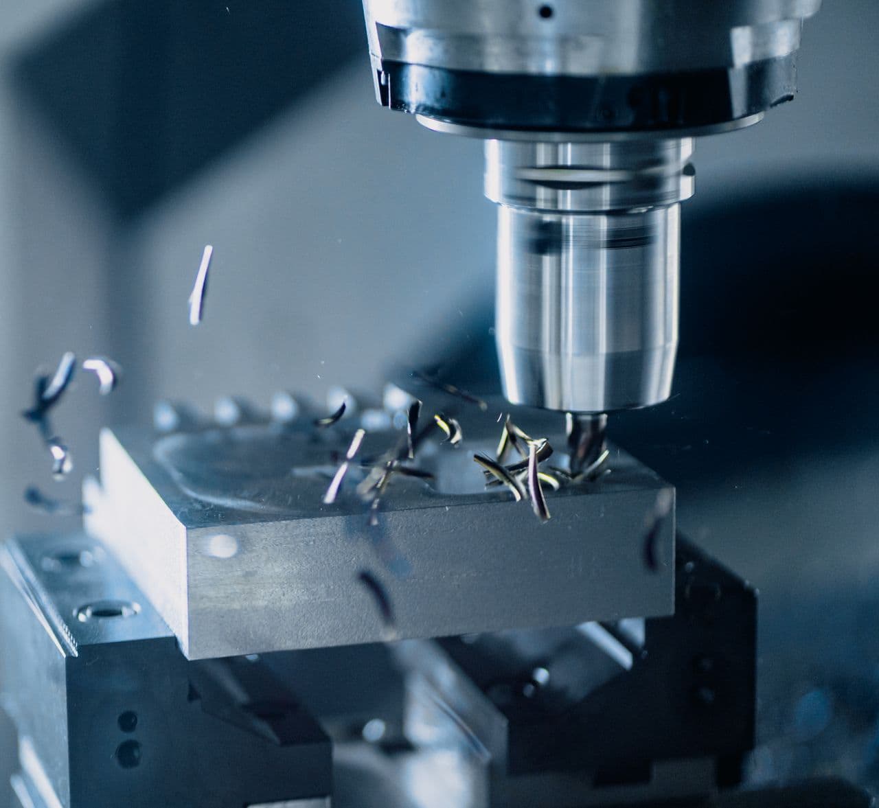 Precision CNC machining of a metal component on a factory floor