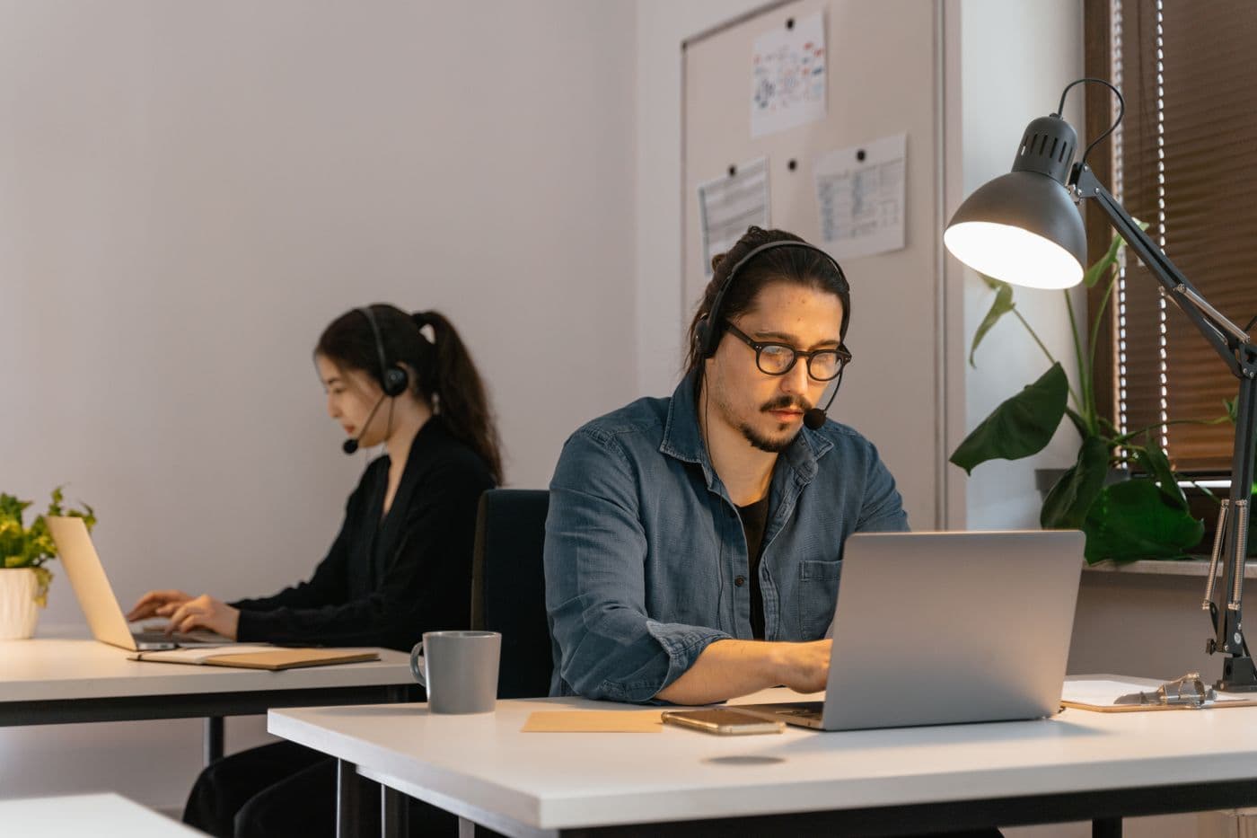 Sales professional working an outbound pipeline on a laptop